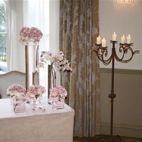 fwthumbCluster of vases with muted hydrangea & phaleanopsis orchids with rustic candelabra. Registrar's table at The Mansion.jpg